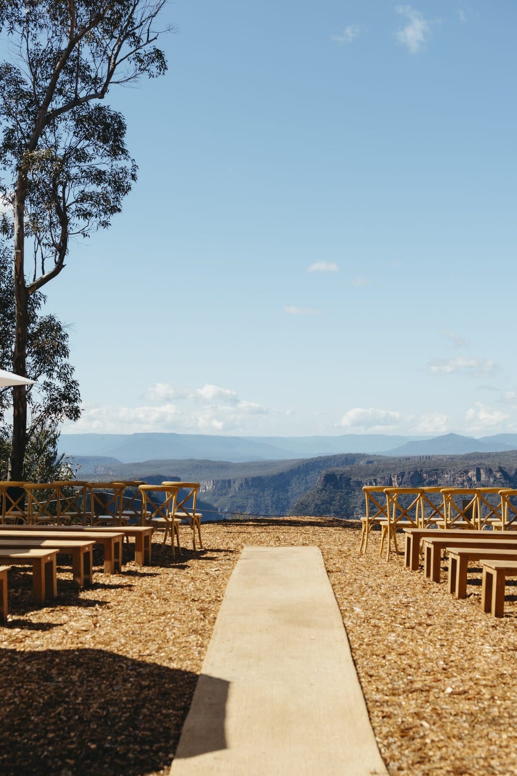 The aisle runner between the timber benches at The Cliffs, the gorge and the far ranges ahead