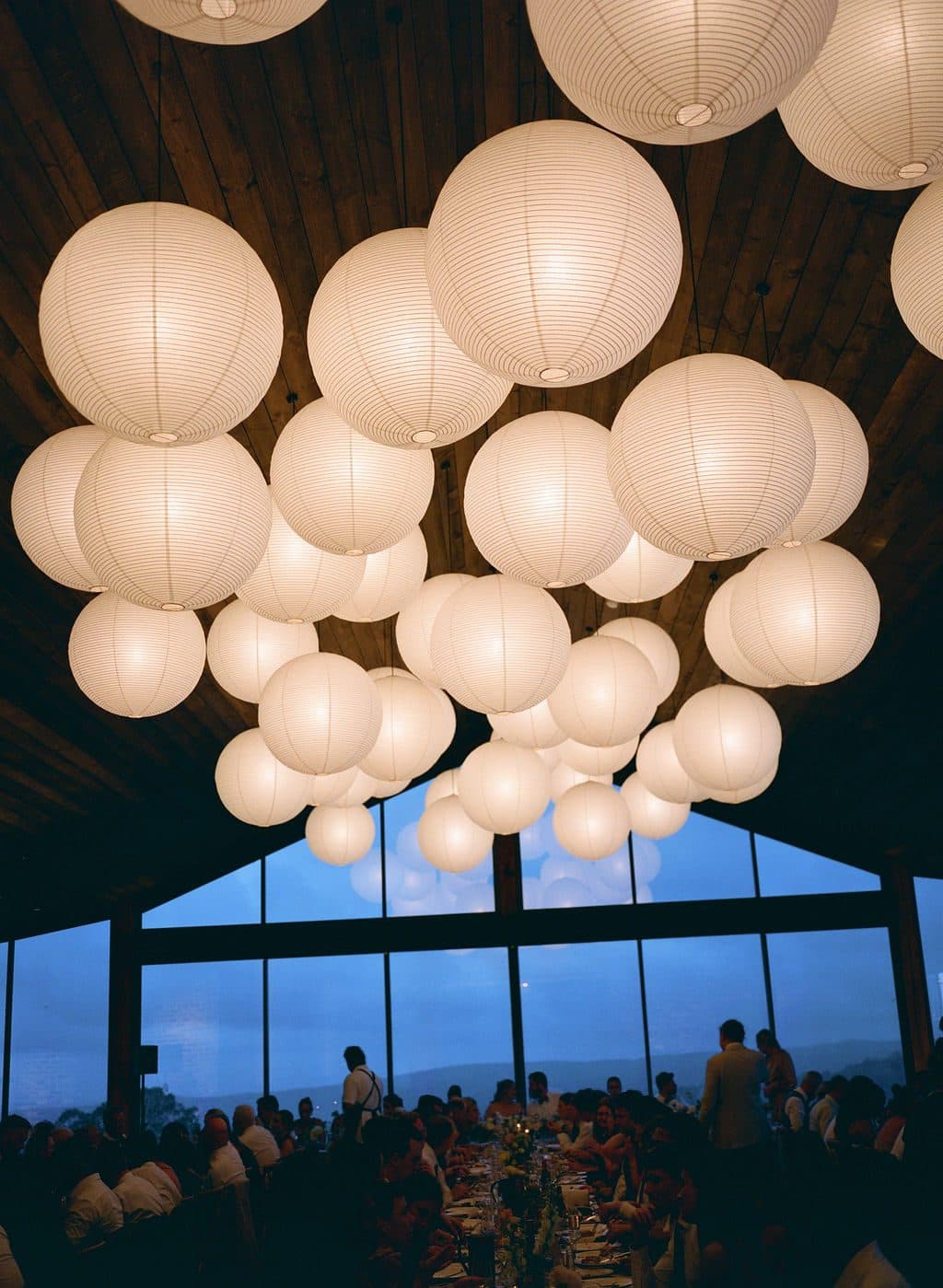 The Pavilion's lantern-lit windows glowing against the night