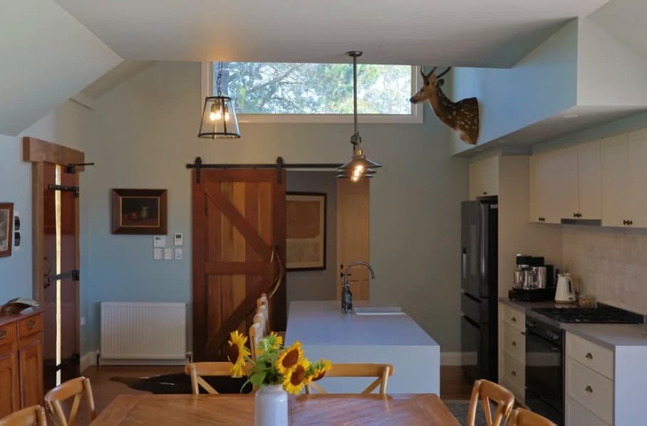 The main bedroom at The Homestead, calm and softly lit