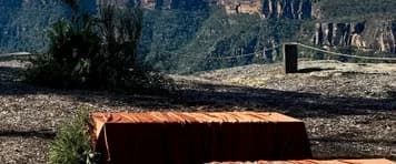 Rope and timber bollard fencing along the cliff edge