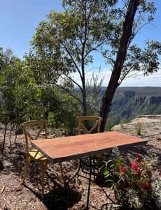Timber signing table and two chairs