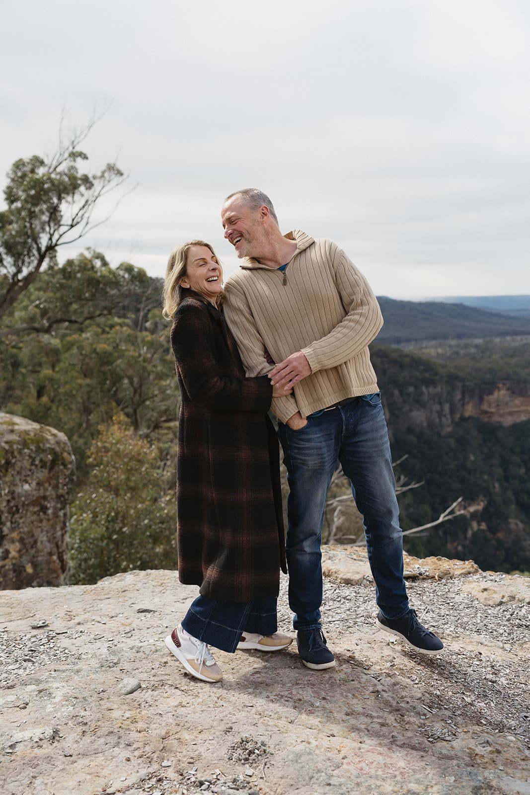 Kathryn and David laughing together on the clifftop above the Shoalhaven gorge