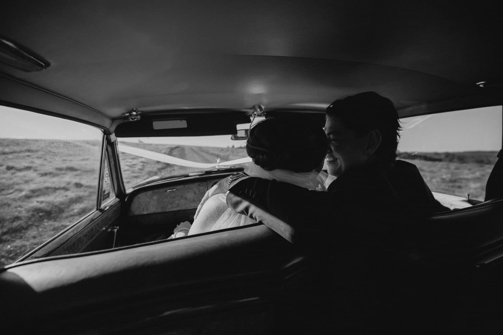 Liv and Ryan in the back seat of the Rolls-Royce, the paddocks through the window