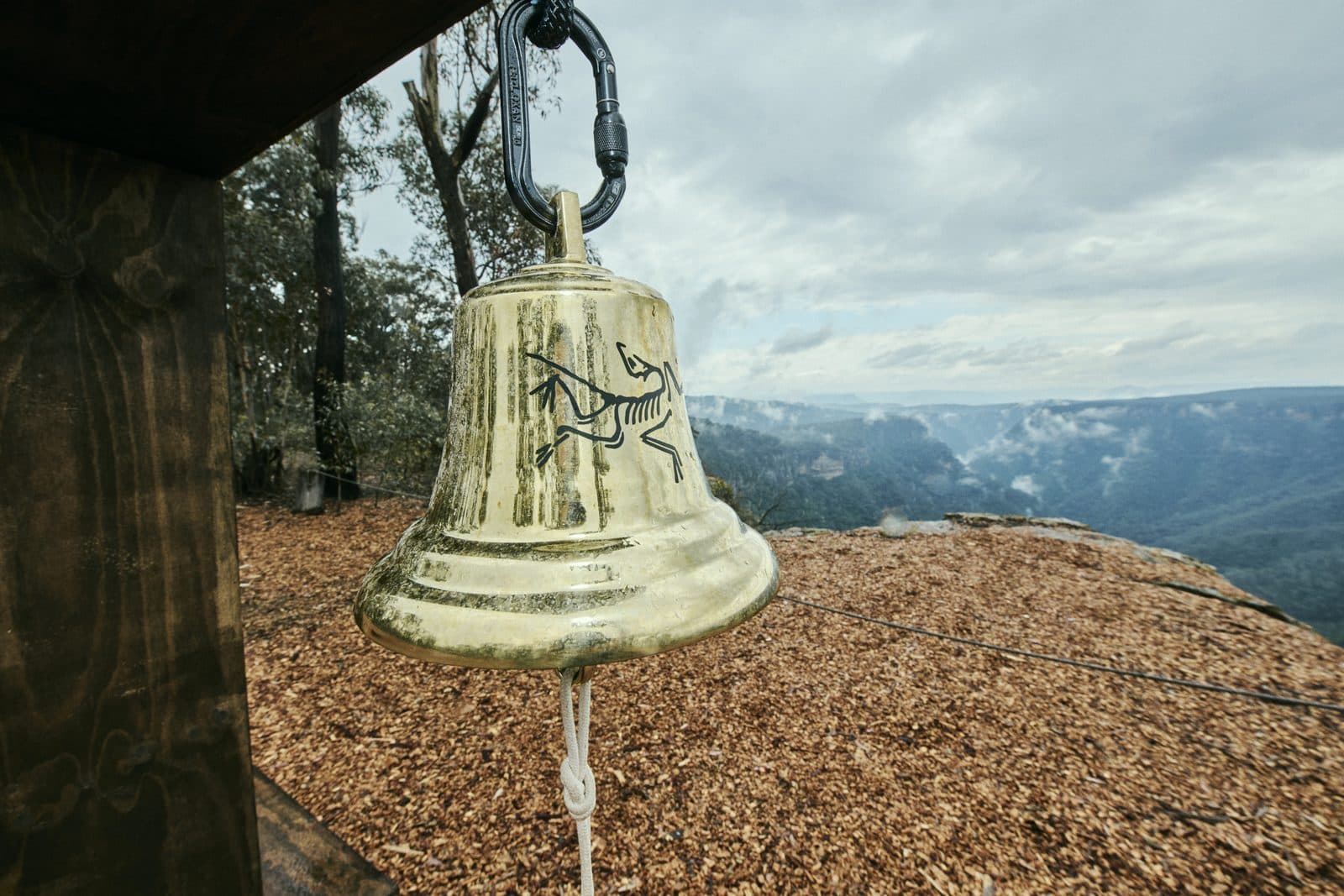 The brass bell close up, the gorge and the ranges beyond