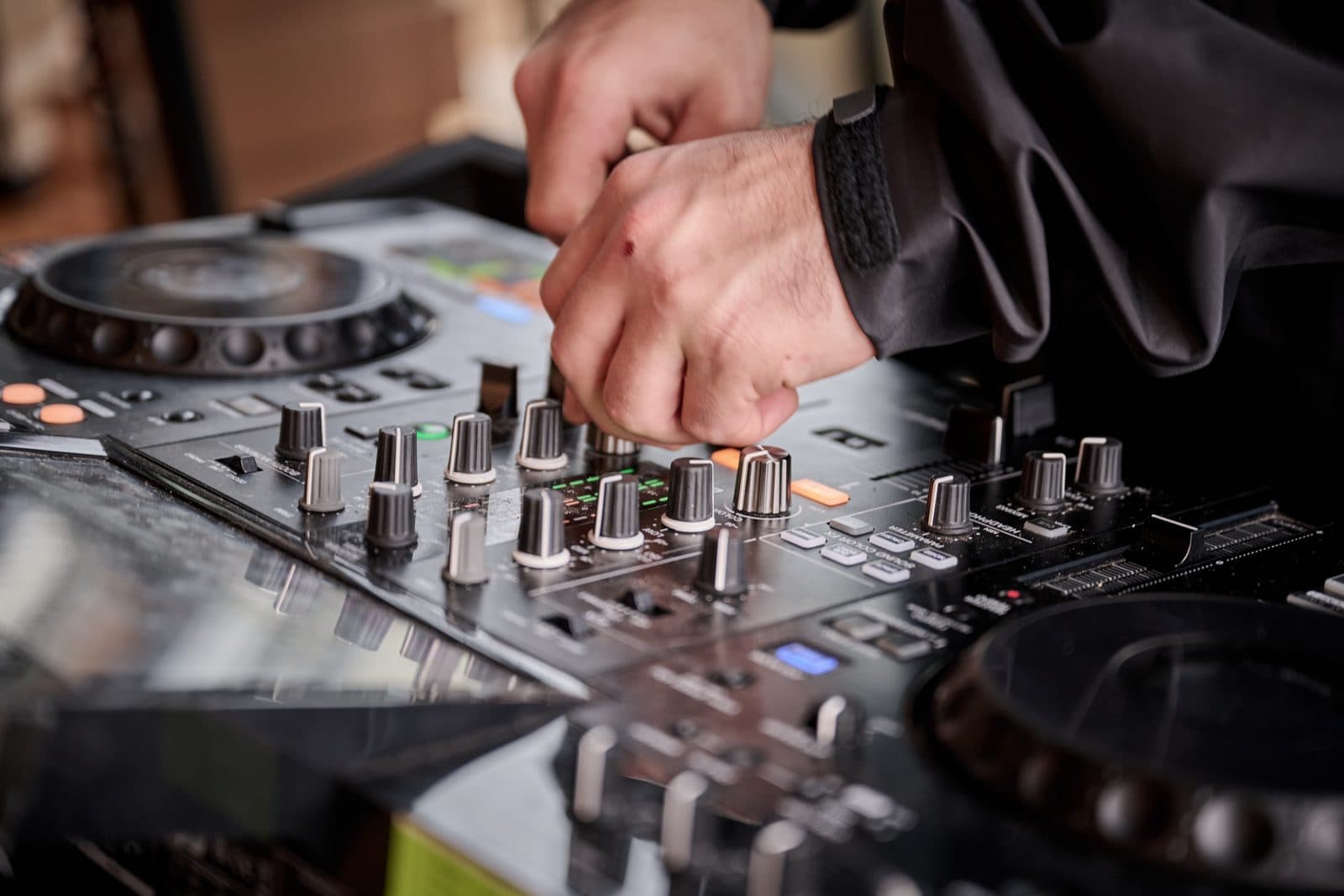 A DJ's hands on the decks inside the Pavilion