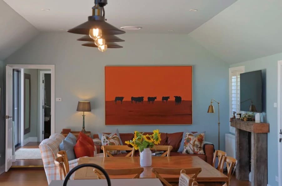 The warm, light-filled living room at The Homestead