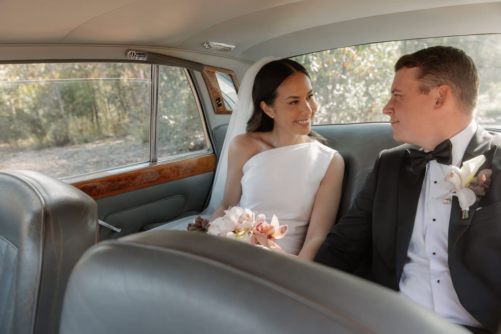 Jamae and Ben in the back seat of the Rolls-Royce