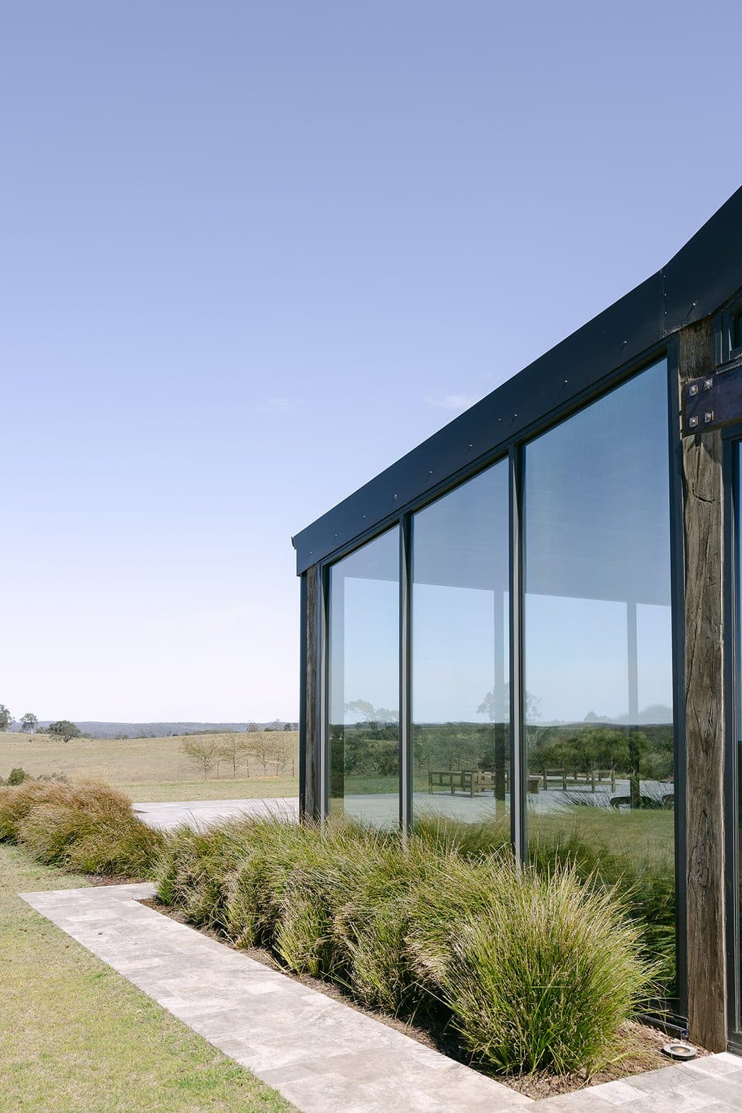The Pavilion from the lawn, its glazed gable open to the country beyond