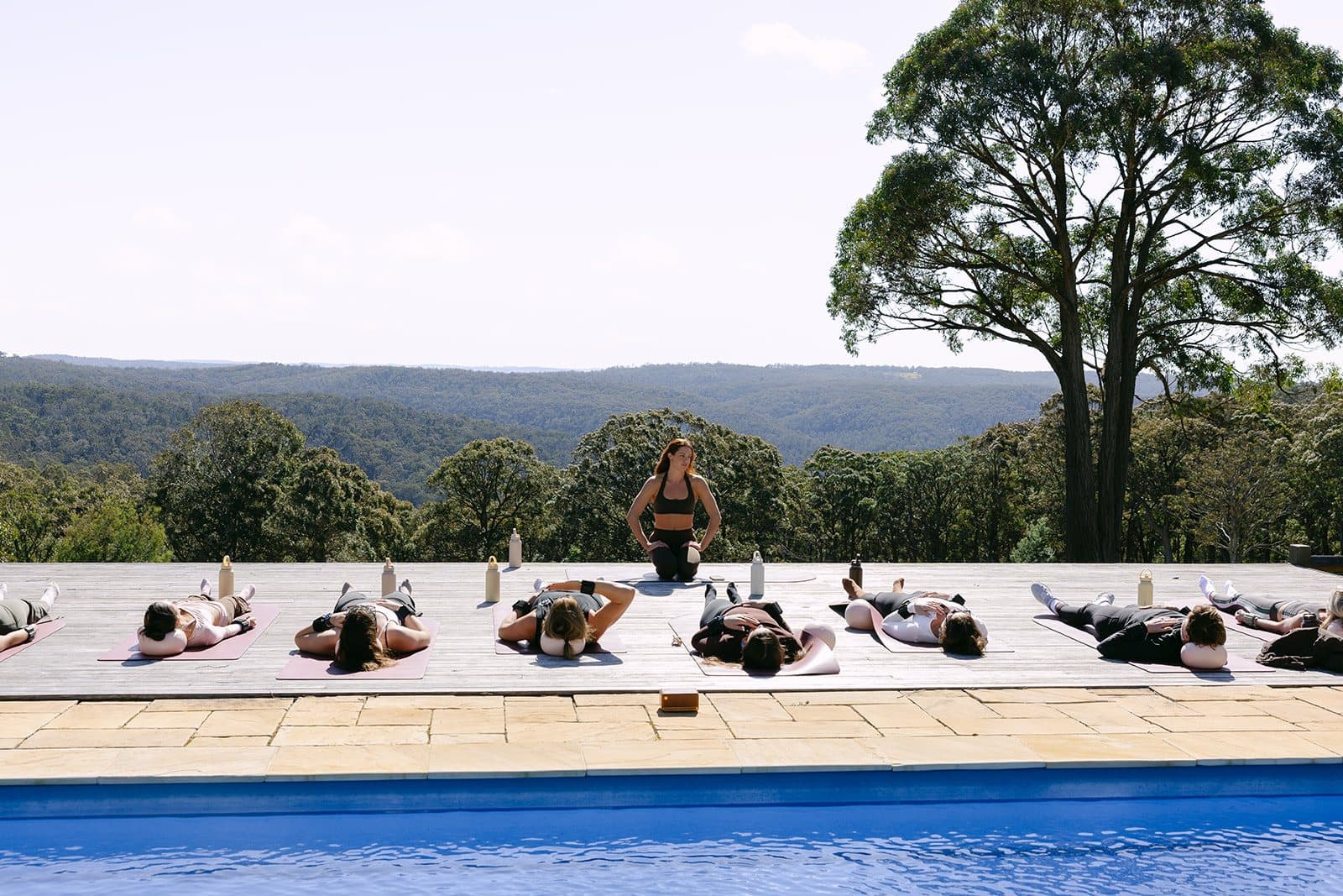 Mats laid the length of the Homestead pool deck, the group lying back at the end of a session with the ranges behind
