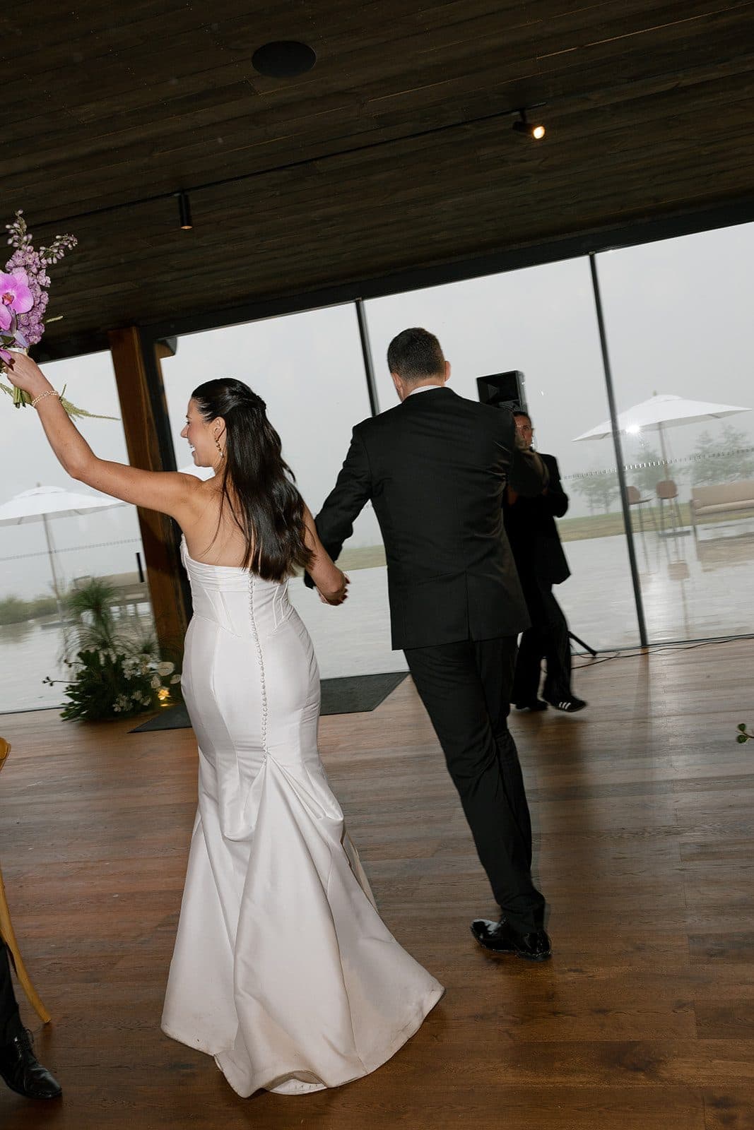Matt and Holly making their entrance into The Pavilion, her arm raised