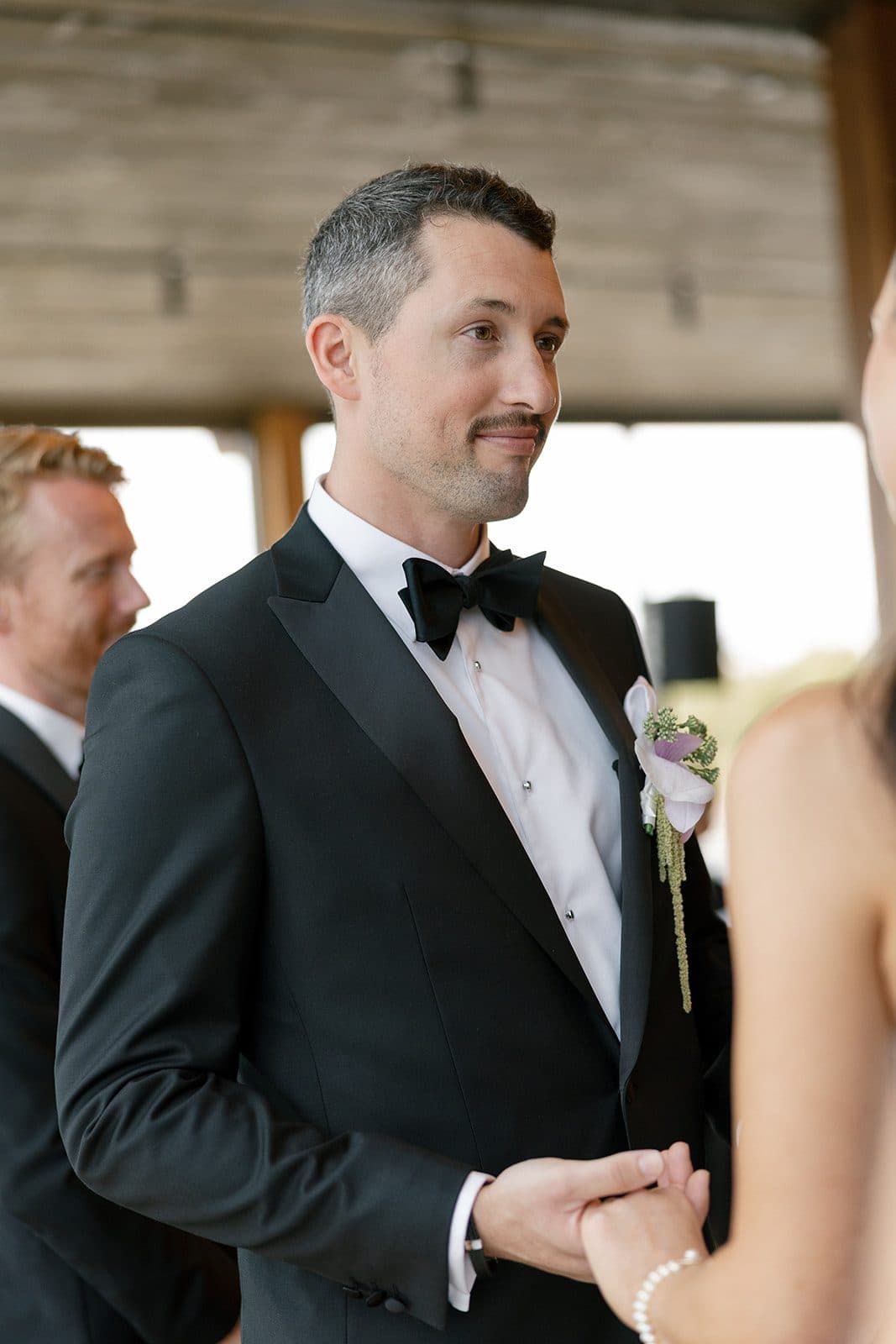 Matt holding Holly's hands during the ceremony