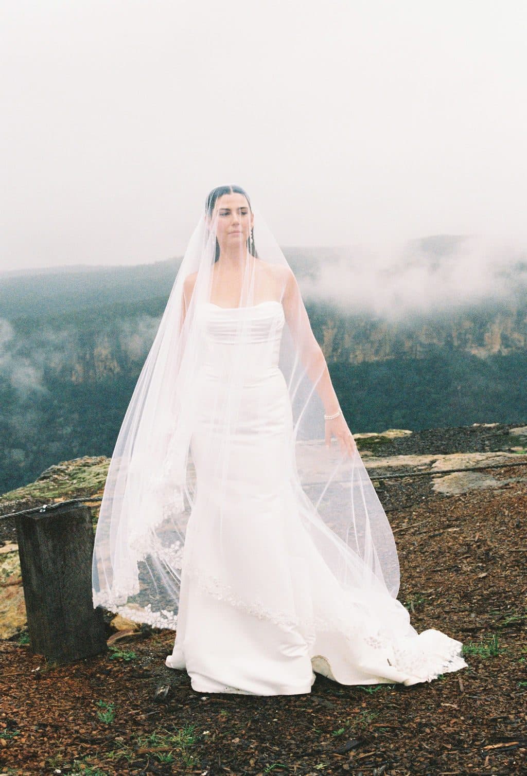 A bride's veil lifting in the mist above the gorge